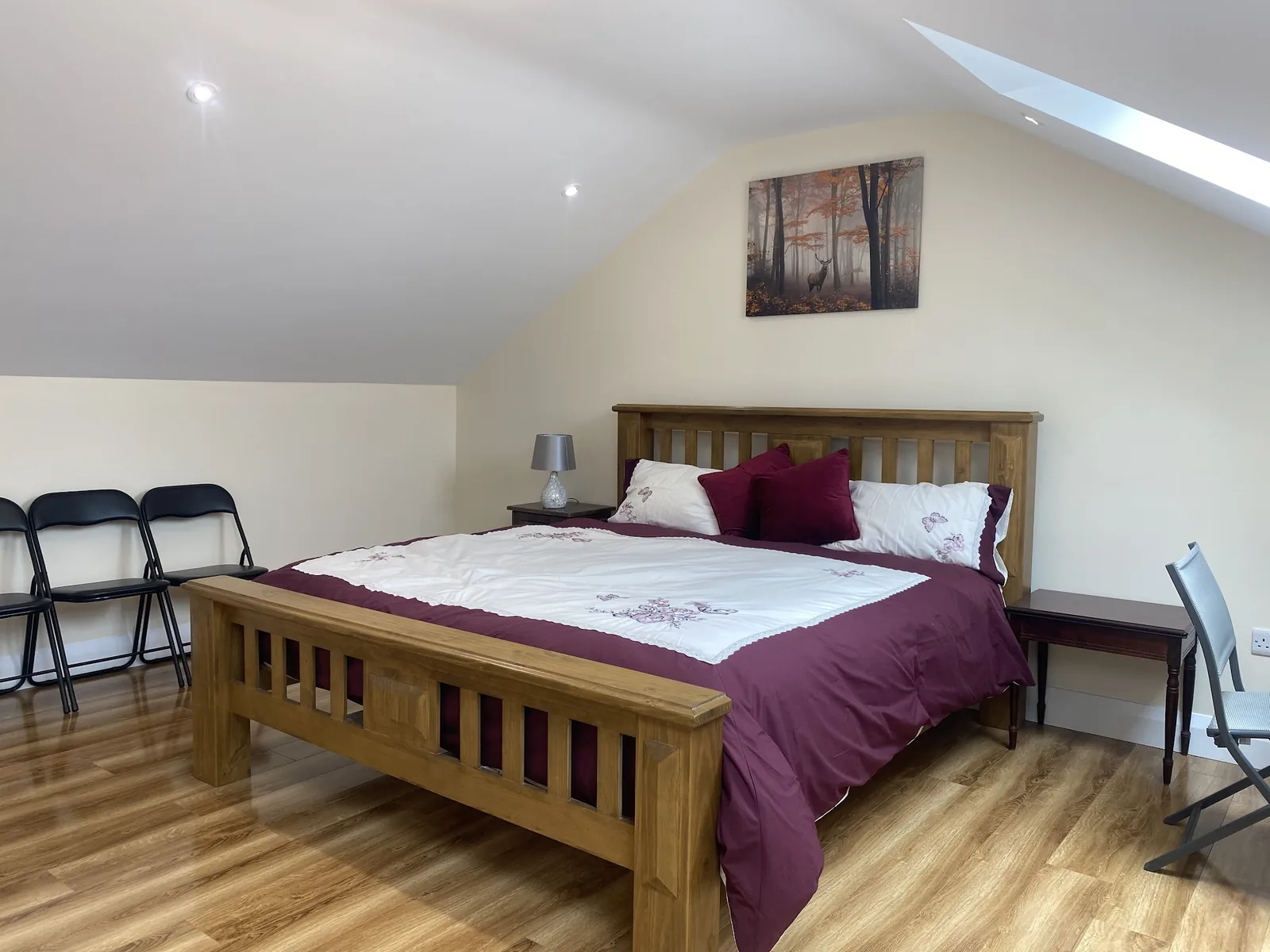 Solid oak attic bedroom with twin Velux