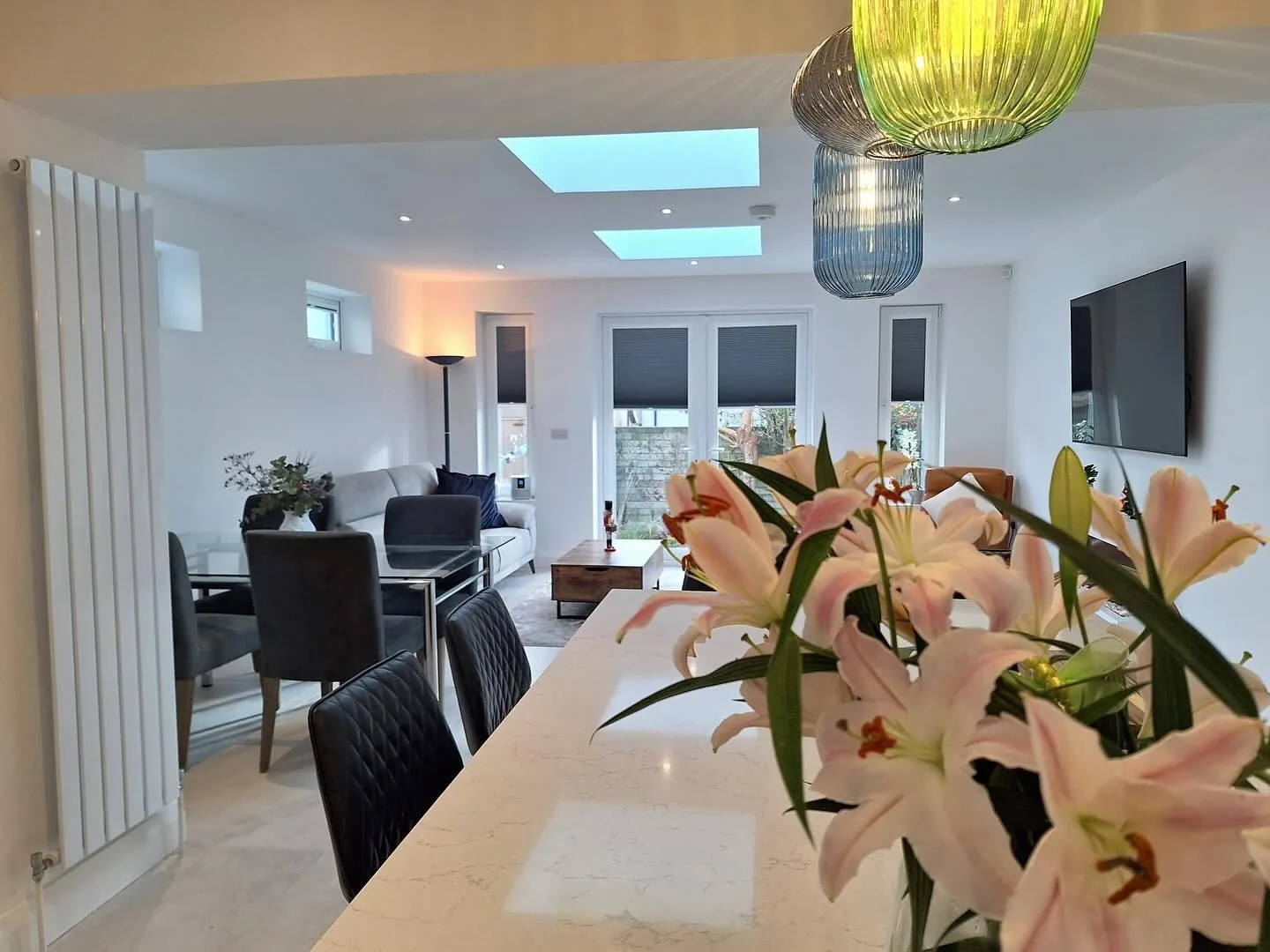 Open-plan kitchen extension with marble island and twin skylights